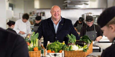 Cook's and fresh ingredients in the kitchen